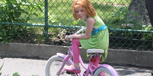 A young girl on a bike